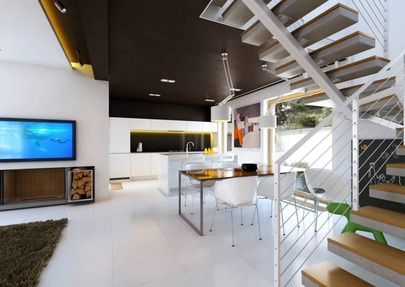 duży salon z otwartą kuchnią i schodami na piętro domu modułowego